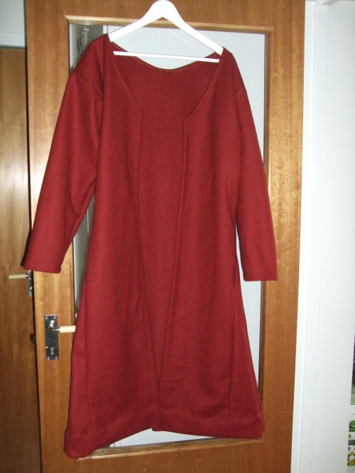 The classic image of this blog, a garment hanging on a door...